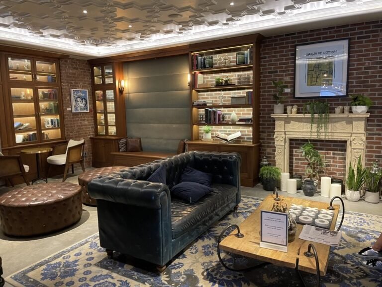 A stylish view of the Arthouse Hotel NYC lobby showcasing its artistic decor and cozy seating areas.