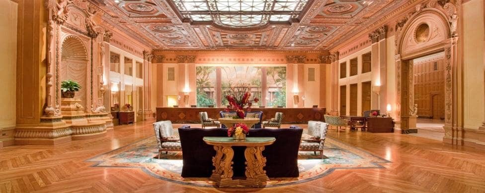 The stunning interior of the Millennium Biltmore Hotel, showcasing its elegant architecture and festive decorations.