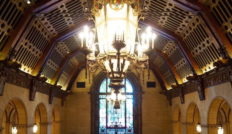 The stunning interior of the Millennium Biltmore Hotel, showcasing its elegant architecture and festive decorations.