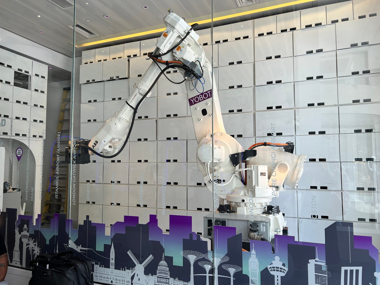 A stylish view of Yotel Times Square showcasing its modern design and vibrant rooftop terrace with city skyline views.